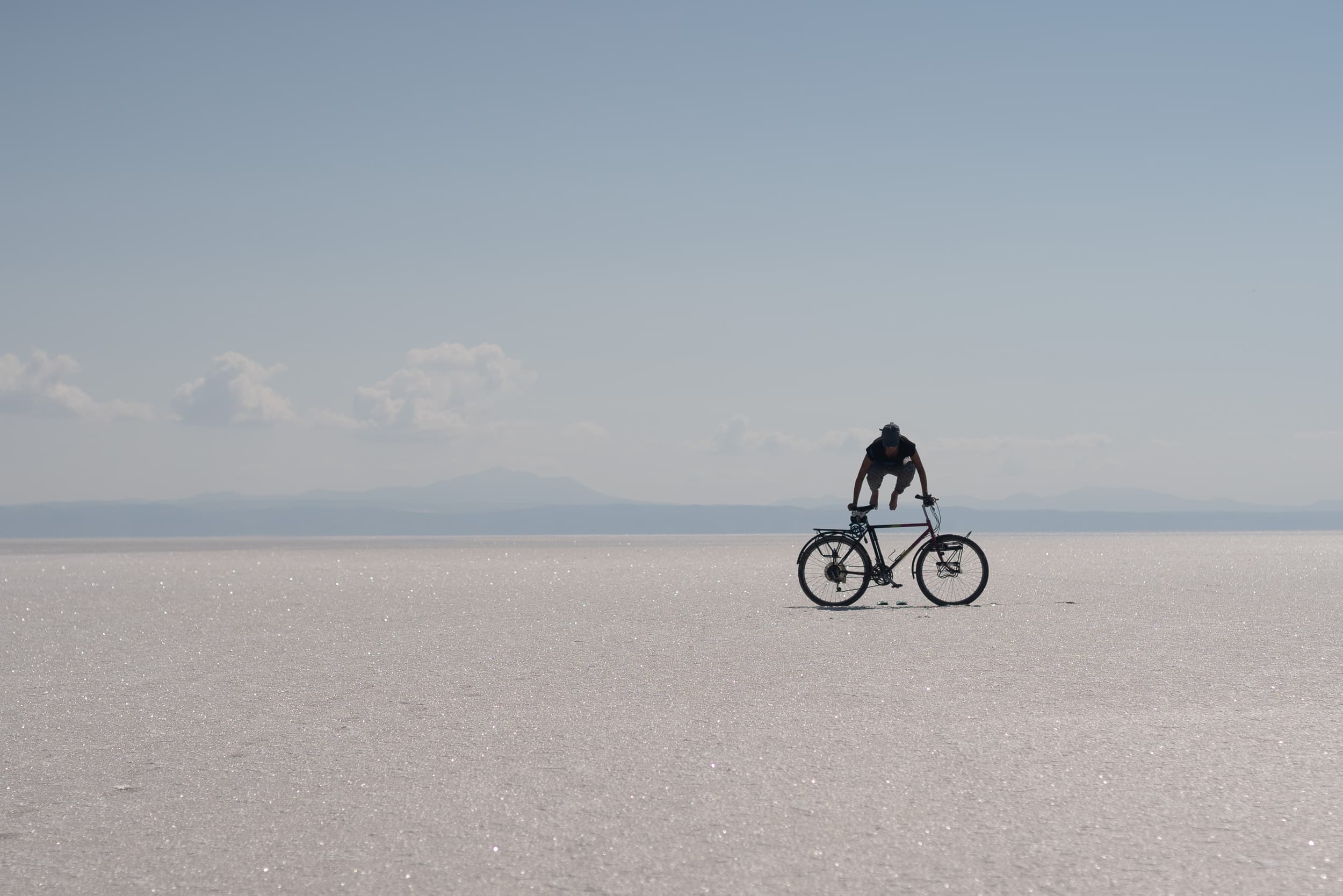 bicycle tourer on Tuzla Gölü salt lake in Turkey