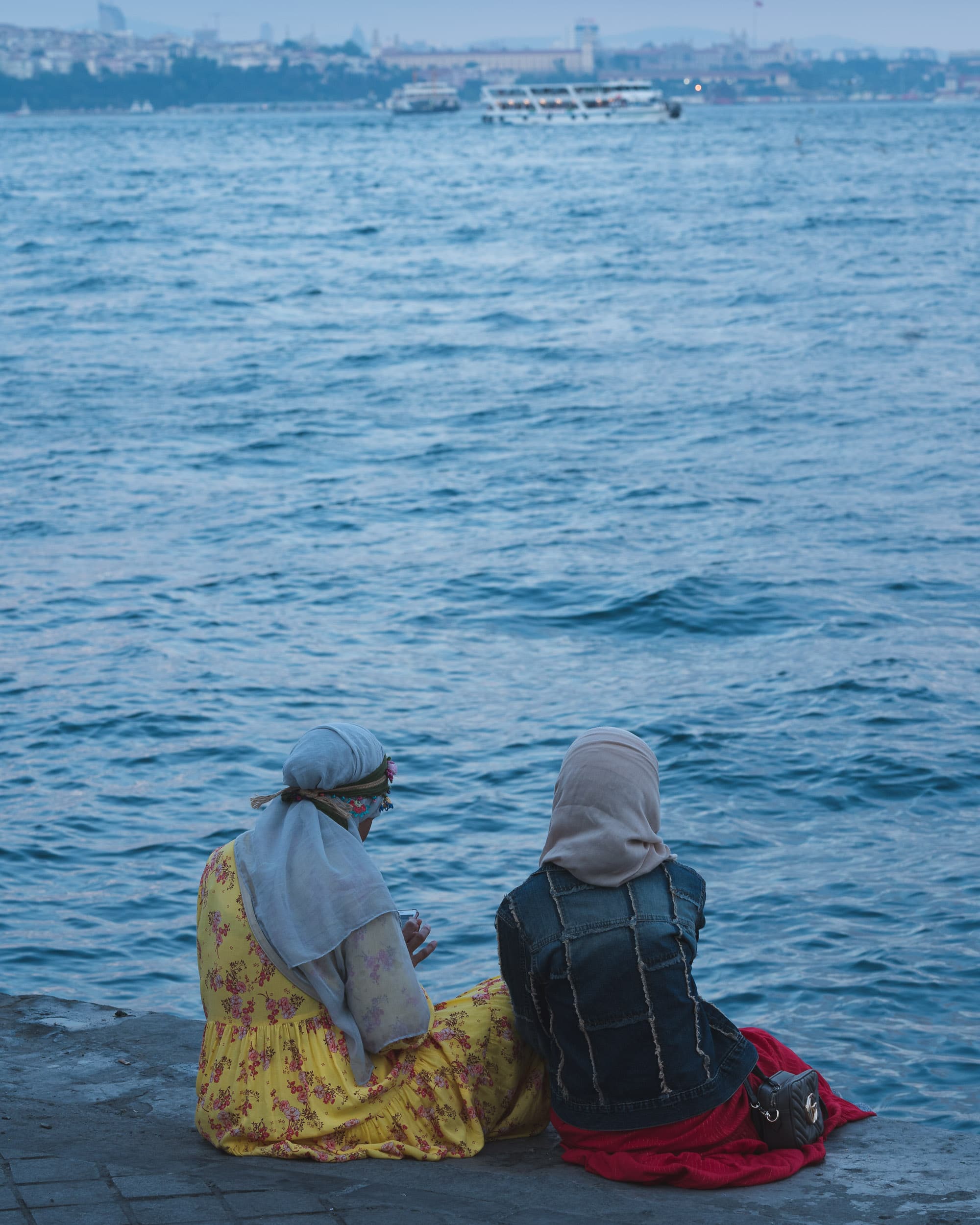 turkish women sitting at bosphorus turkish women sitting at bosphorus