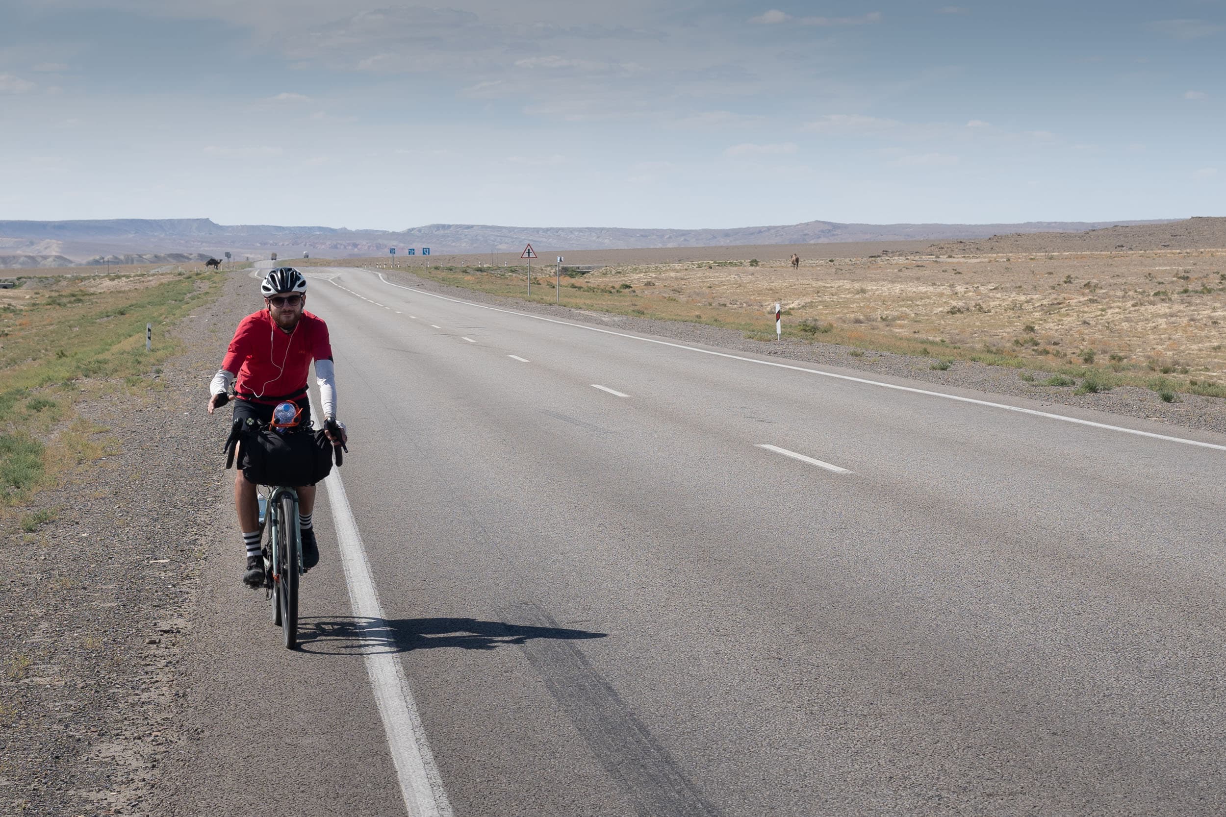 Andrew cycling the Kazakh desert Andrew cycling the Kazakh desert