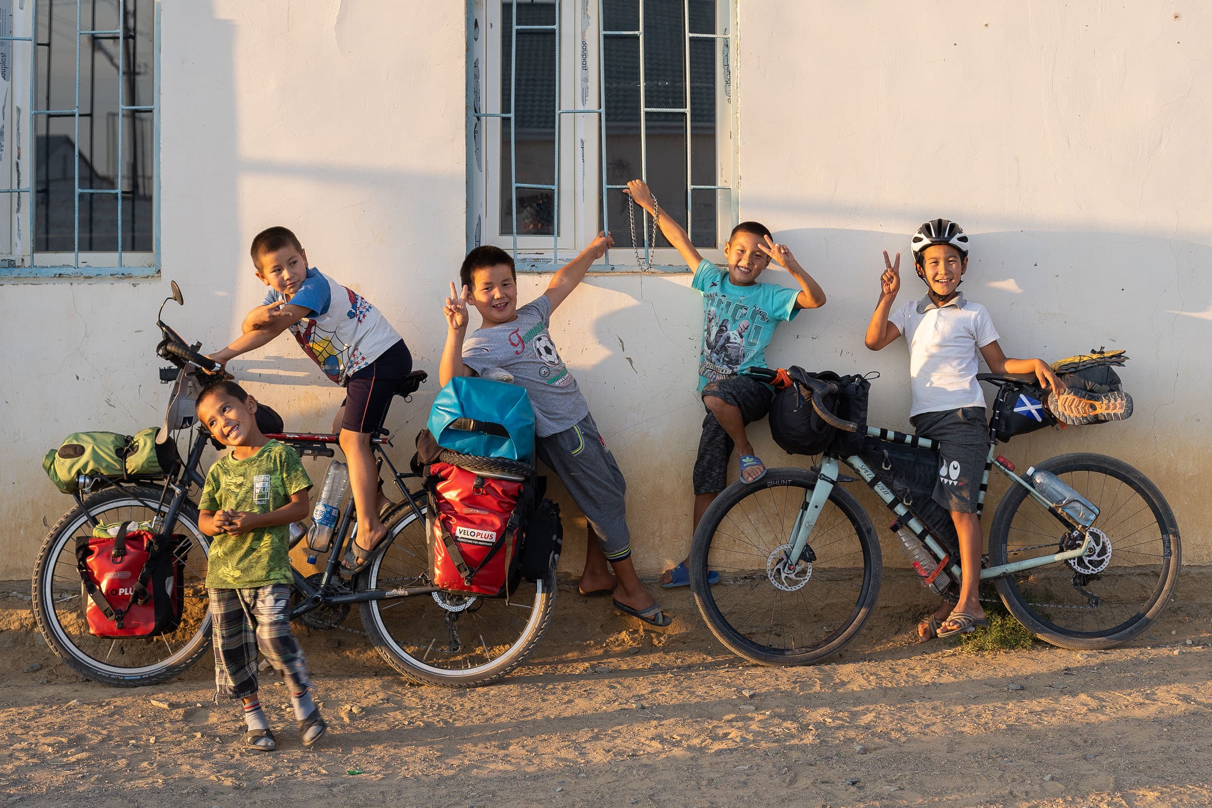 Kazakh kids posing with bicycles