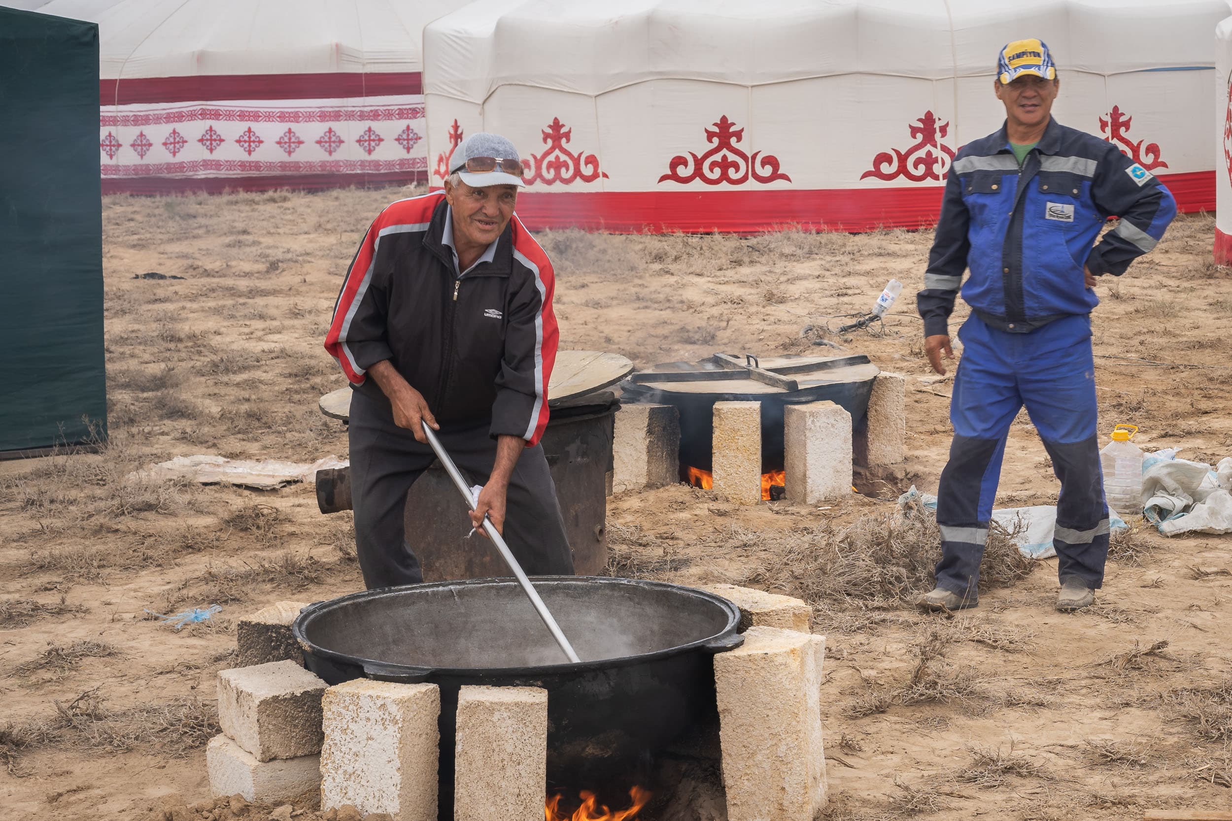 Kazakh man preparing plov