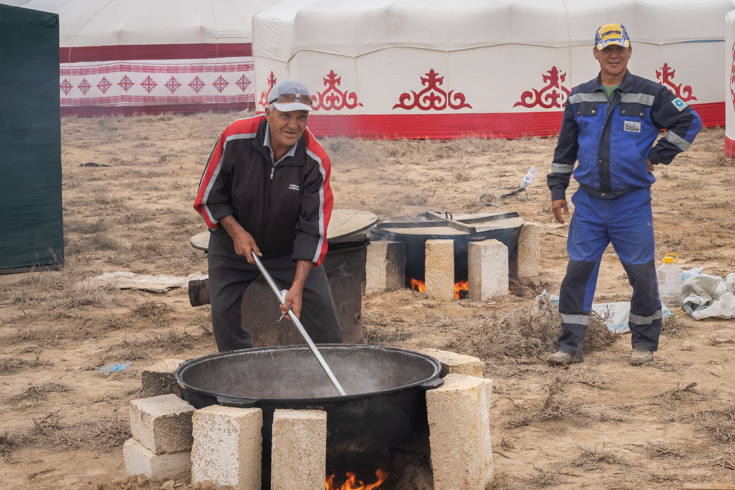 Kazakh man preparing plov Kazakh man preparing plov
