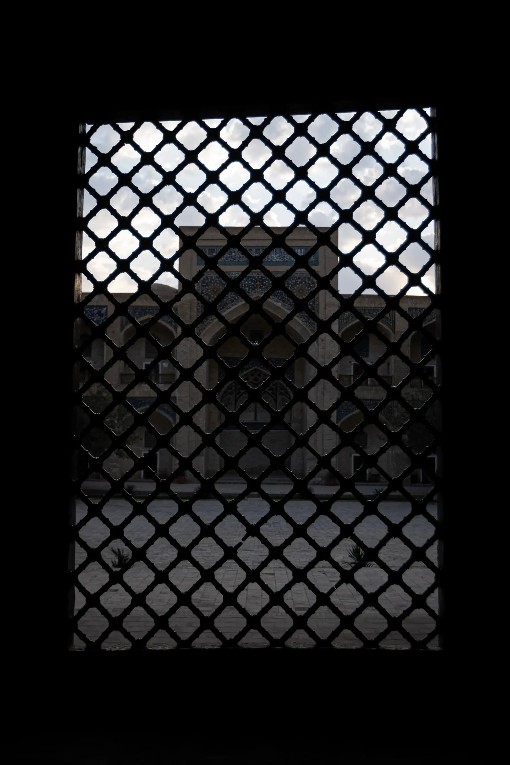Bukhara Madrasa behind bars