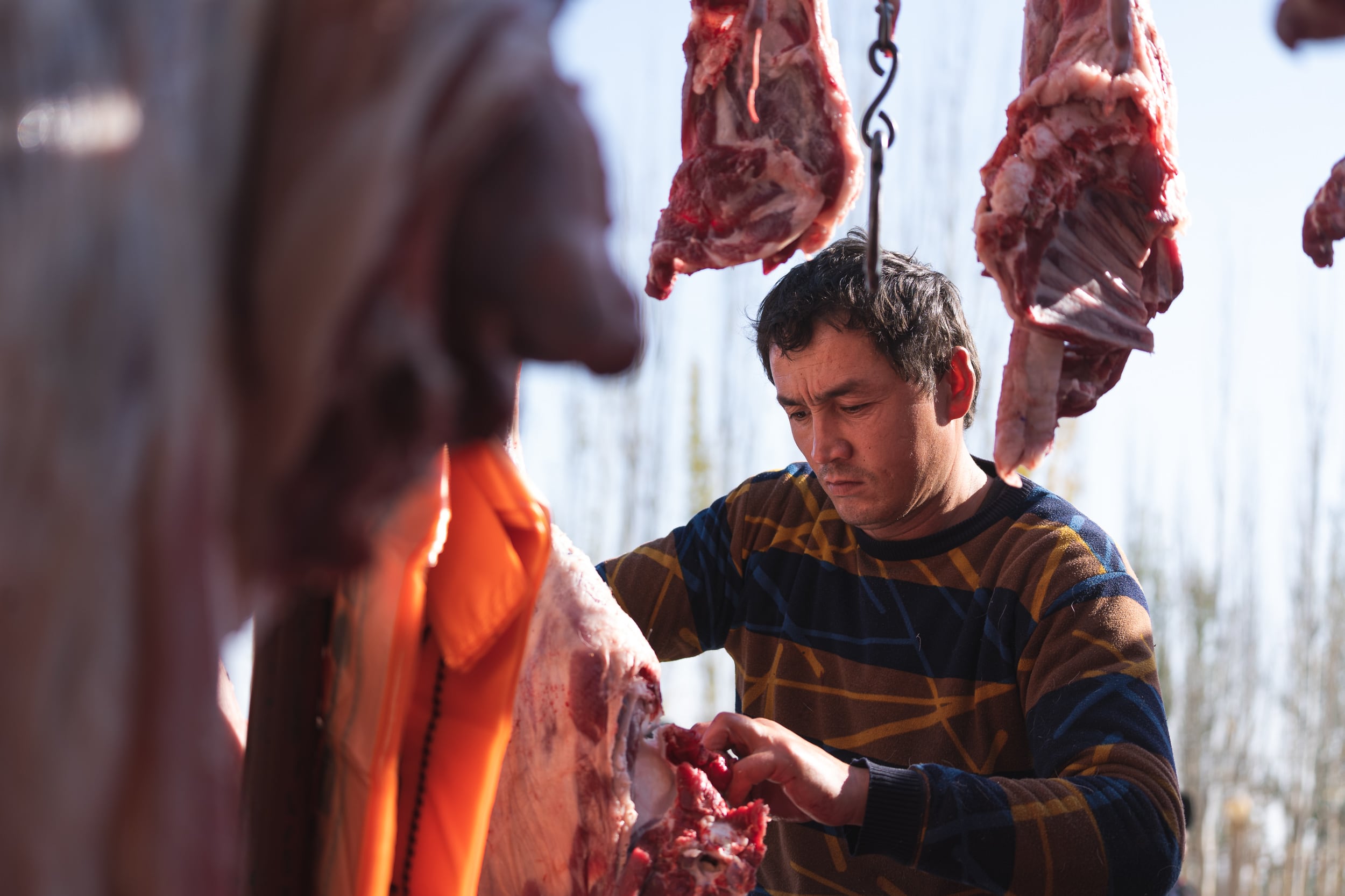 butcher at livestock market Kashgar butcher at livestock market Kashgar